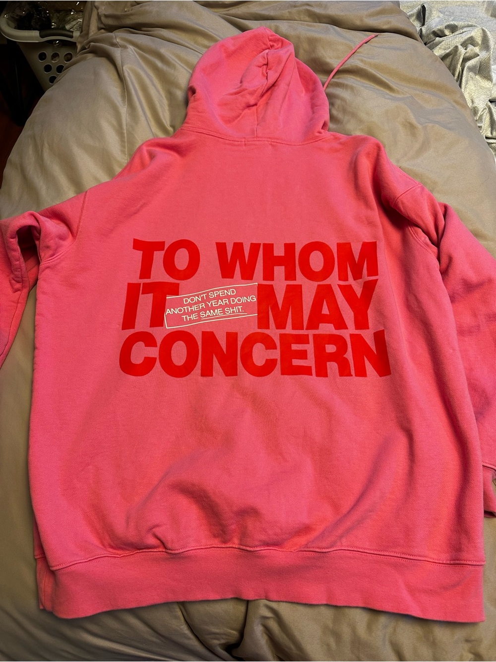Pink Graphic Hoodie with Bold Red 'To Whom It May Concern' Print